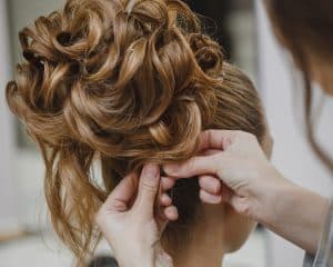 A bride having her hair styled for the wedding day. One of the services that The Mane House at Bloomsburys Biddenden in Kent offer.