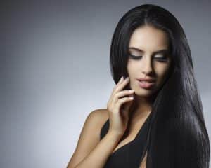 A young women with a hair extensions, one of the services that The Mane House at Bloomsburys Biddenden in Kent offer.