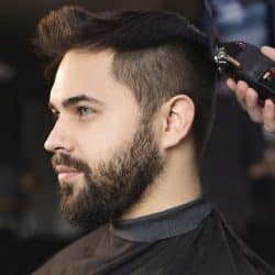 A gentlemen having his hair cut and styled, one of the services that The Mane House at Bloomsburys Biddenden in Kent offer.